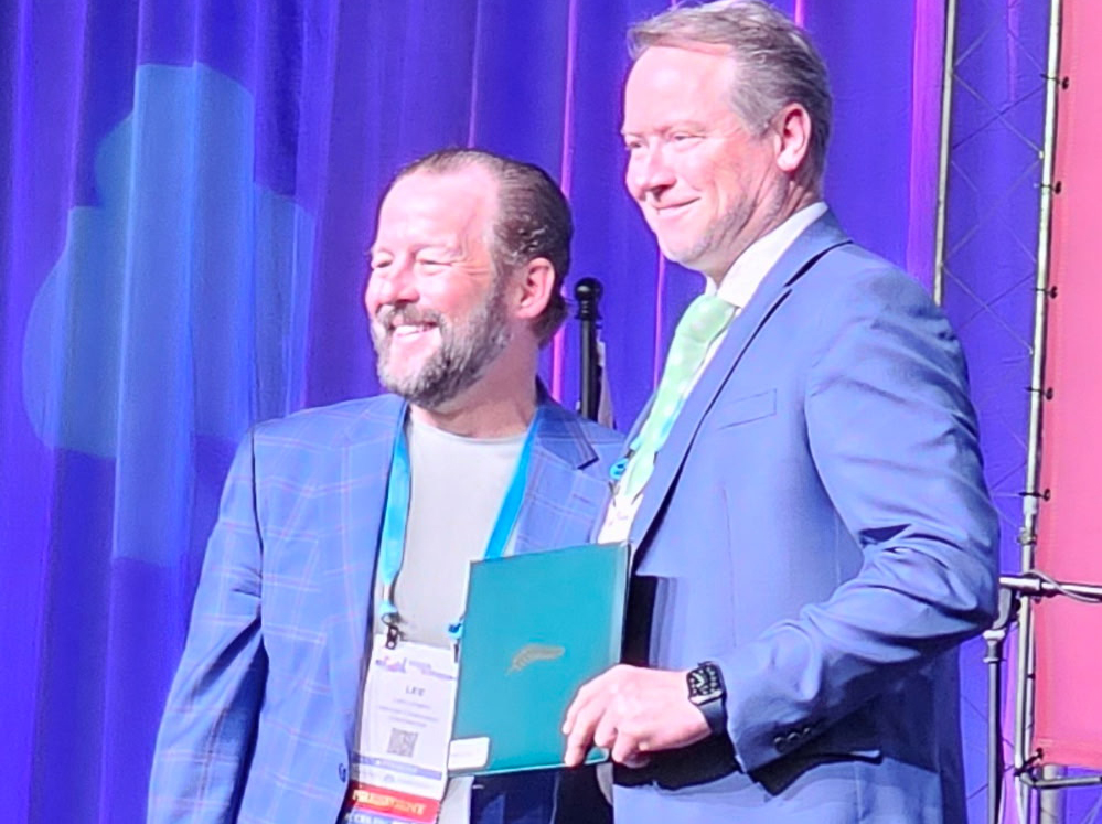 Darren getting a quarter century award from ICCFA in 2025
